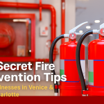 A realistic photo of bright red fire extinguishers and a fire hose reel in a clean commercial building, with text overlay reading “10 Secret Fire Prevention Tips for Businesses in Venice & Port Charlotte.” The image is in landscape orientation, optimized for a blog post and Google update, conveying professionalism and fire safety.